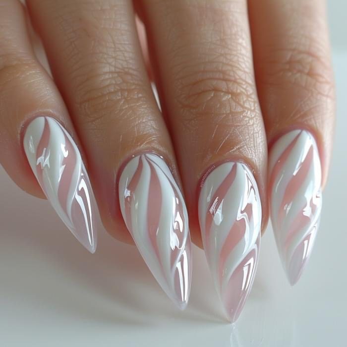 Stiletto nails with glossy white and pink swirl design